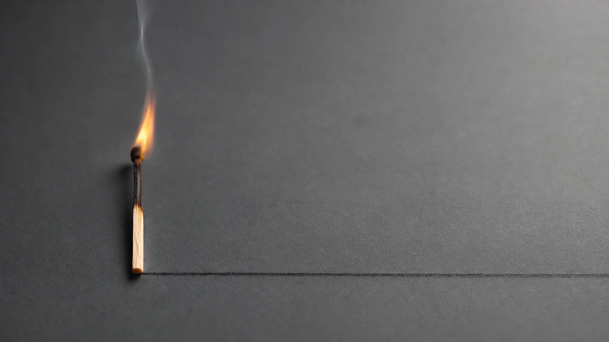 A single match's flame fades to smoke while a faint unbroken line continues steadily across the frame beside it.
